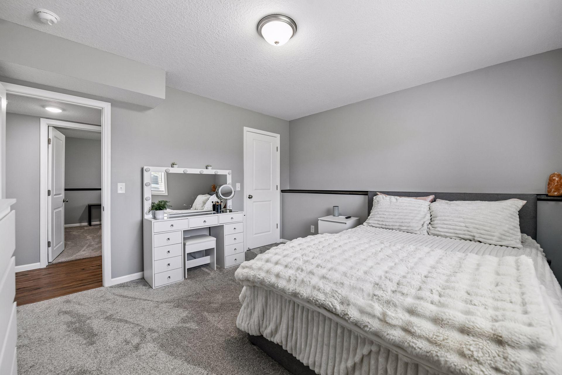 This bedroom has a large walk-in closet. Can never have enough closet space.