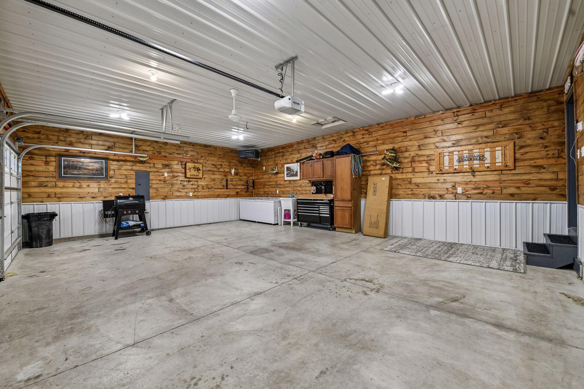 CALLING all garage peeps! Finished with vapor barrier, insulated, tongue and groove pine and HEATED! Ideal to enjoy year round.