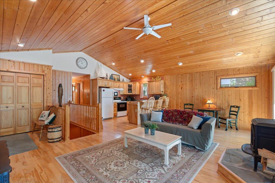 The open living and kitchen area gives the main level a wonderfully spacious feel, creating the perfect gathering space for family and friends