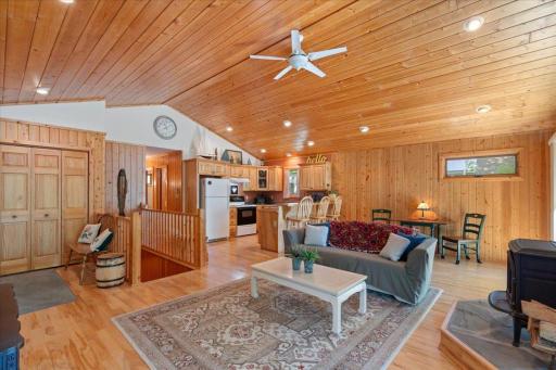 The open living and kitchen area gives the main level a wonderfully spacious feel, creating the perfect gathering space for family and friends