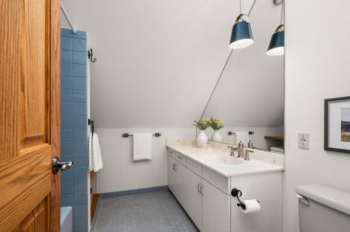 The skylight in the vaulted 3rd floor full bath brings natural light by day and welcomes soft moonlight on clear nights.