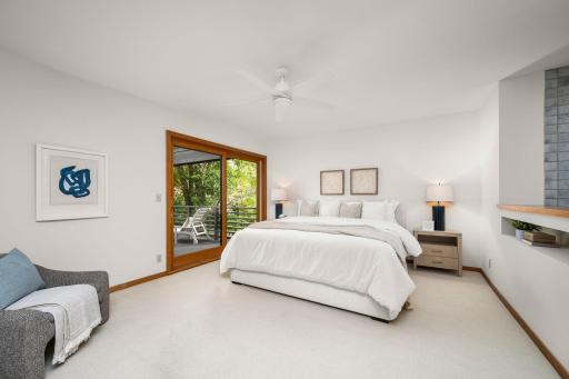 Your Primary Suite offers partial views of the private beach and Smithtown Bay