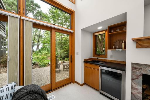 The wet bar with dedicated wine and beverage cooler is a brilliant design feature made for the consummate host.