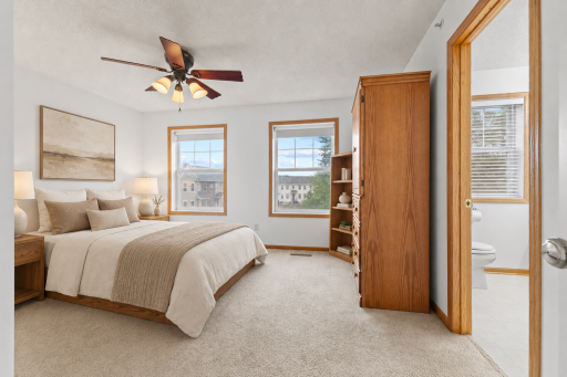 Virtually staged—wake up to natural light and enjoy the convenience of a private bath nearby.