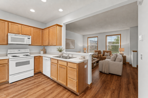 Virtually staged—the open sightlines keep the kitchen connected to the heart of the home.