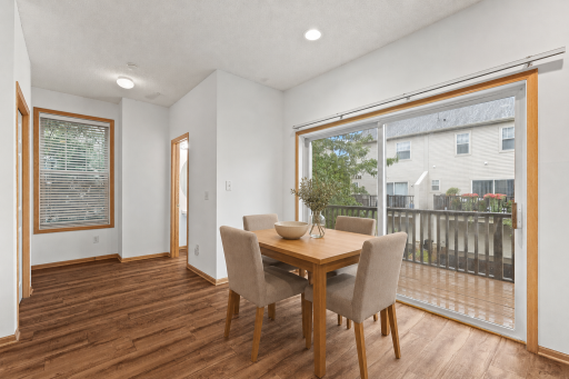 Virtually staged—dine beside the deck and enjoy an easy flow between indoor and outdoor living.