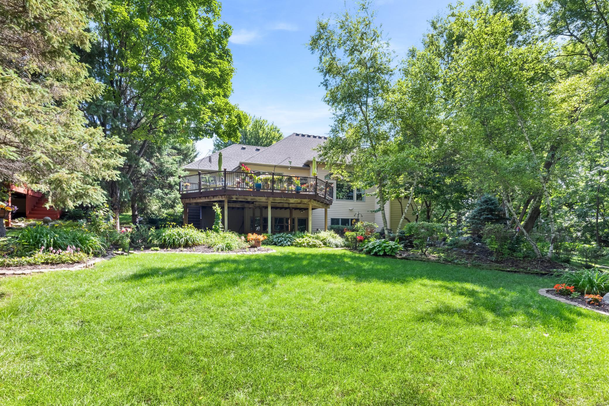 Deck overlooks yard & gardens
