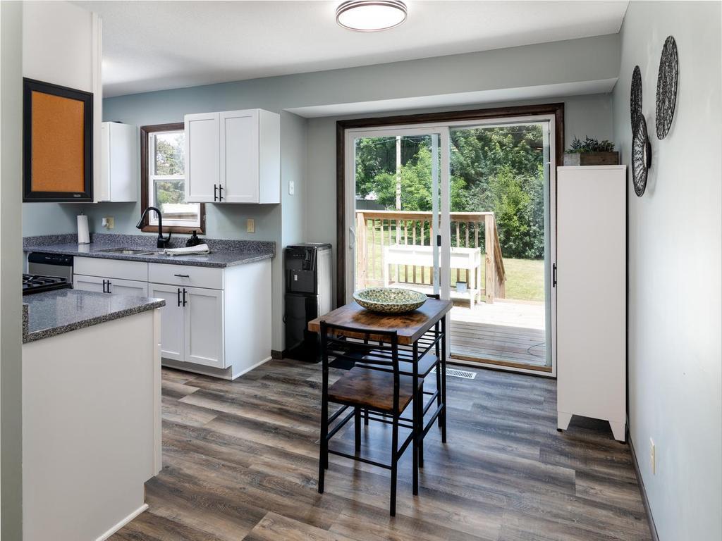 Kitchen dining area with a slider to the backyard deck