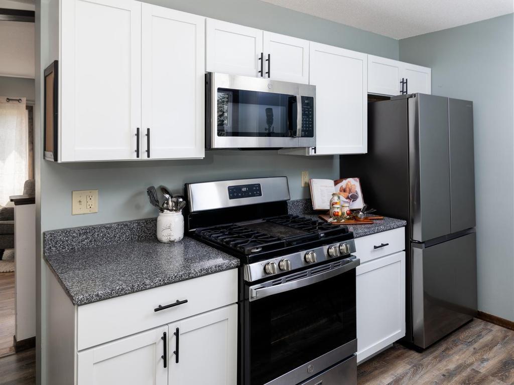 Stainless steel gas range, microwave & French-door refrigerator