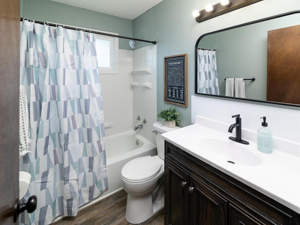 Refreshed main-floor full bath with tub/shower & updated fixtures
