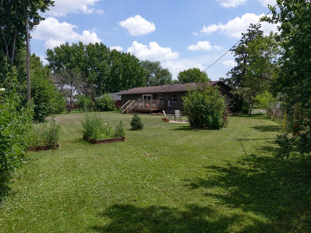 Huge, flat backyard with raised garden beds & room to roam