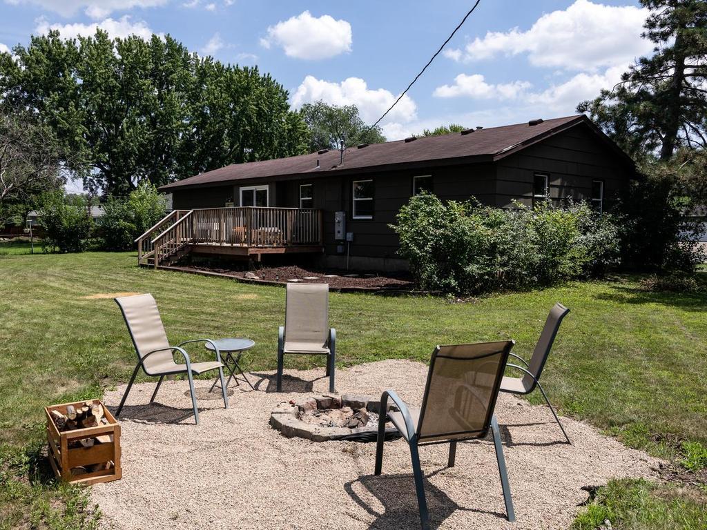 Pea-gravel fire pit patio just steps from the deck