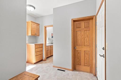 Spacious mudroom with built-in cabinetry and convenient garage access.