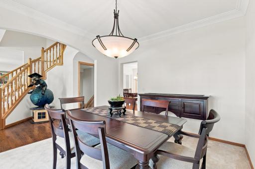 Spacious formal dining room showcases quality finishes, abundant natural light, and timeless design for everyday dining or special occasions.
