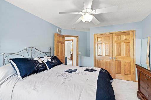 Spacious secondary bedroom with large window and generous closet.
