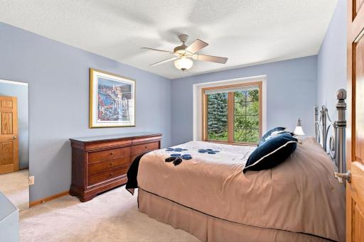 Spacious secondary bedroom with large window and generous closet.