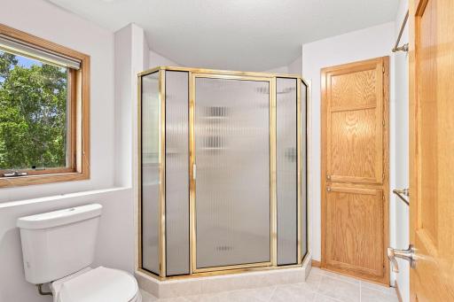 Separate walk-in shower completes this spacious primary ensuite.
