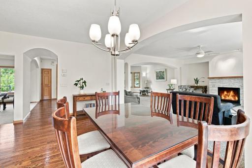 Open dining room with hardwood floors and seamless entertaining flow.