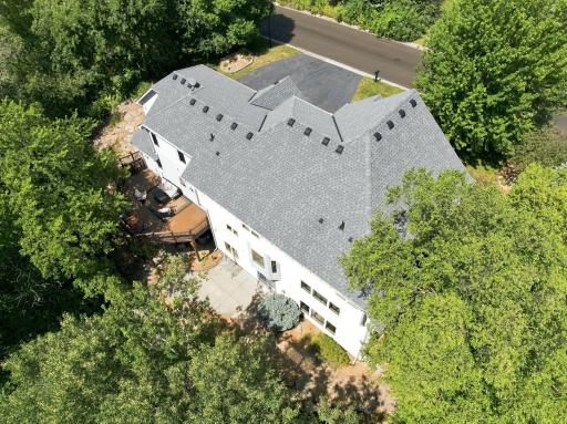 Private backyard surrounded by mature trees offers exceptional privacy rarely found in Lakeville. Multiple outdoor entertaining spaces, extensive landscaping, and peaceful wooded views create your own backyard retreat.
