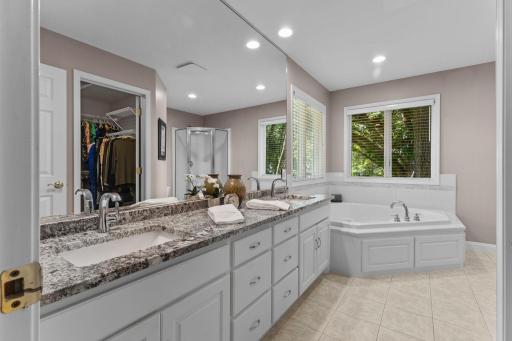 Soaking tub with natural light from the window.