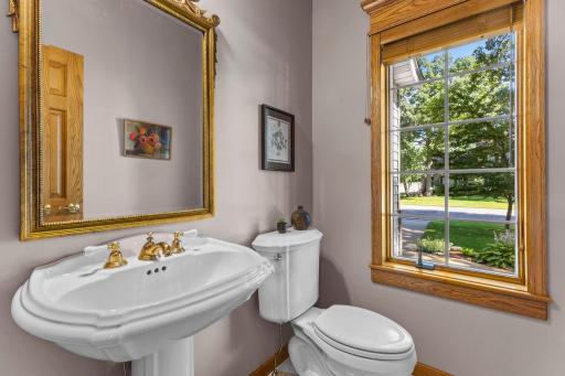 Powder bath located next to the laundry room with front yard views.
