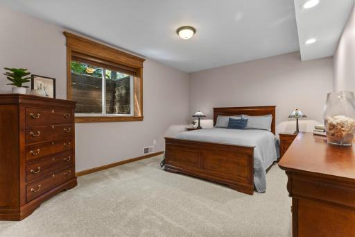 Lower level fifth bedroom with plenty of natural light.