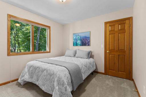 Third bedroom enjoys peaceful backyard views and storage.