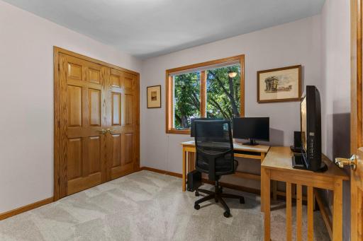 Second level bedroom with backyard views on the upper level.