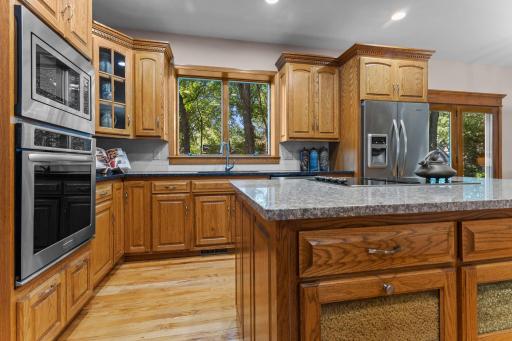 Fresh tile backsplash and a walk in pantry keep everything current and organized