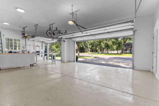 Three-car finished garage with epoxy flooring.