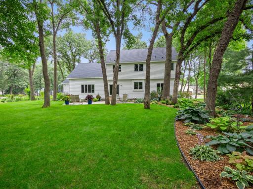 Mature trees and landscaping complete this spacious back yard.