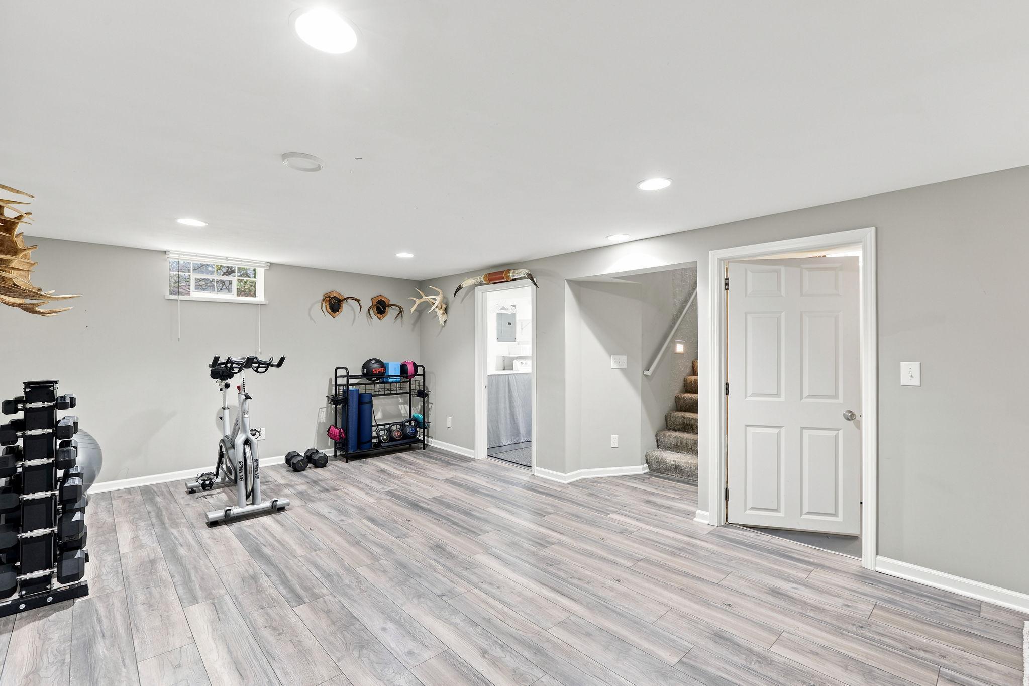 Spacious lower level family room with neutral finishes!