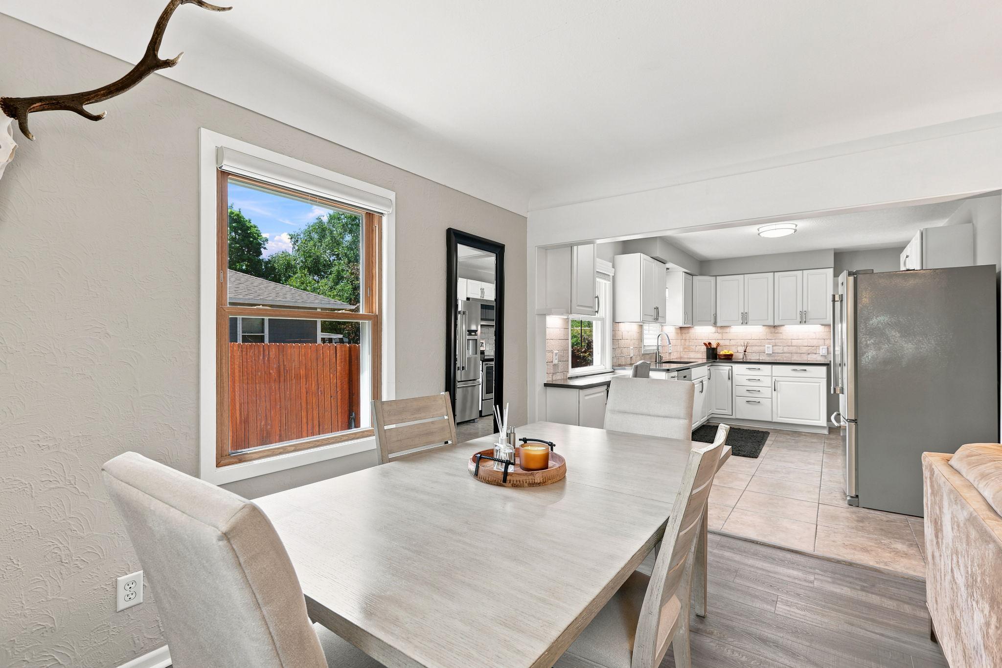 The dining room seamlessly flows into the updated kitchen!