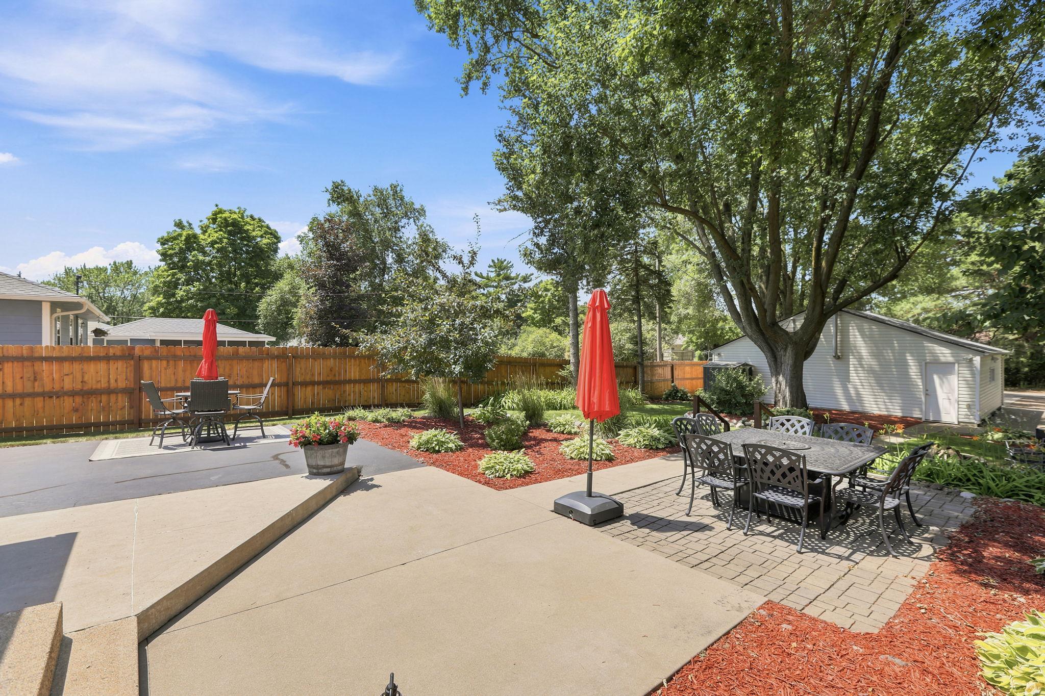 Professionally landscaped with huge, established perennial beds including Hostas, Peonies, Irises, Lilies, and Hydrangeas!
