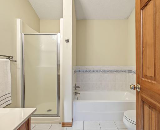 A separate shower, tub, and linen closet complete the primary bathroom.