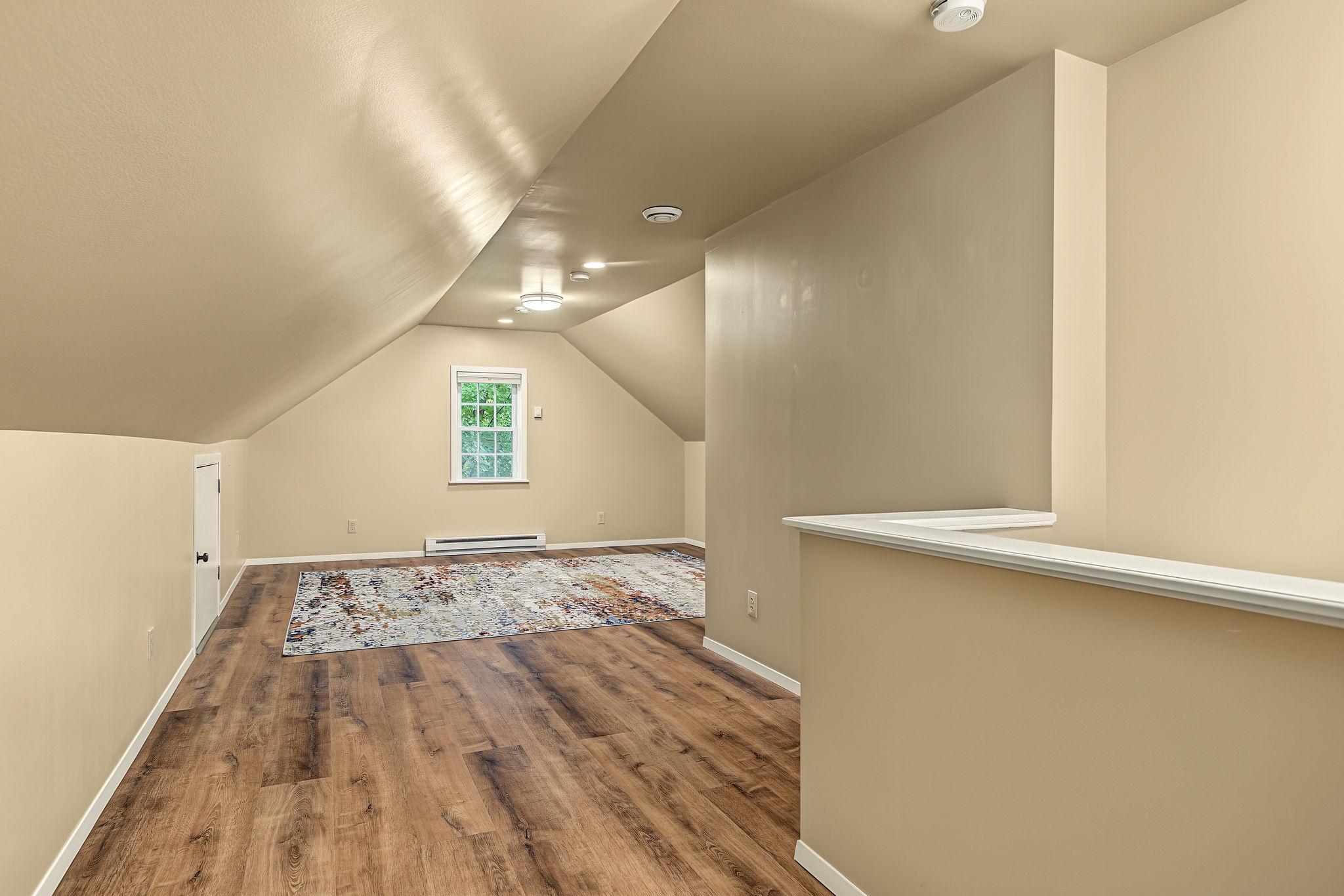 The upper level is spacious and could easily accommodate a full suite of bedroom furniture and a separate seating area. The current owners used it as an exercise room, but it could make a fabulous playroom or office too.