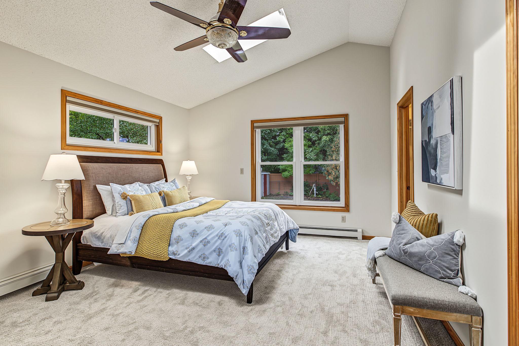 A 2001 addition created a true main floor primary suite which is rarely found in homes of this vintage. The vaulted ceilings and skylights add to the sense of space in this already spacious bedroom. A walk-in closet and full bath round out this room.