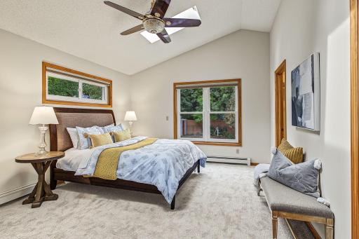 A 2001 addition created a true main floor primary suite which is rarely found in homes of this vintage. The vaulted ceilings and skylights add to the sense of space in this already spacious bedroom. A walk-in closet and full bath round out this room.