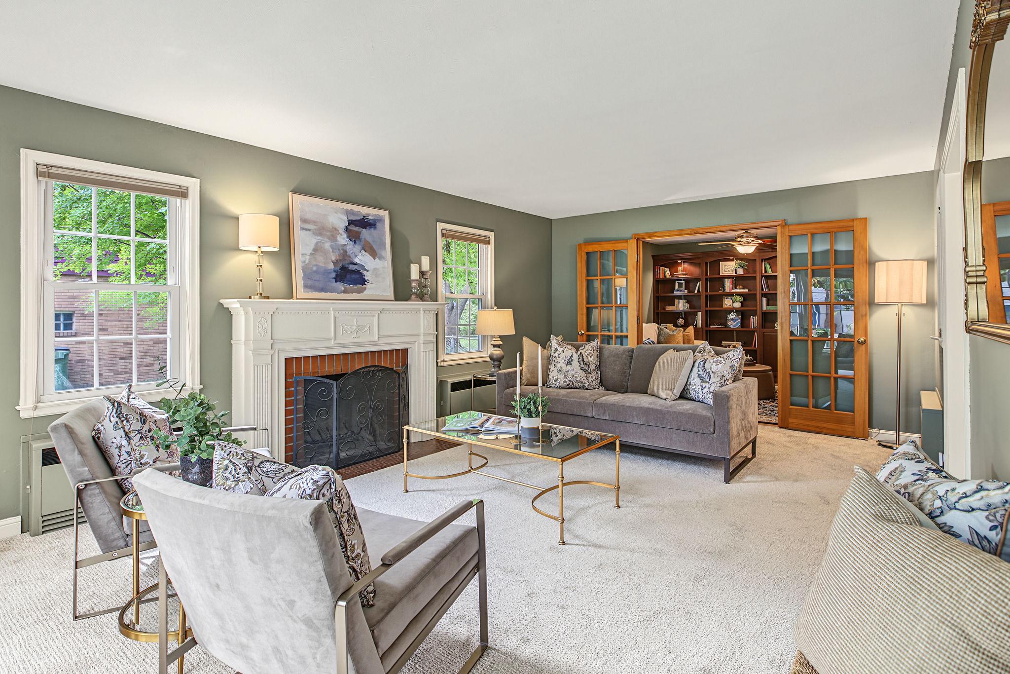 Adjacent to the living room is a den with operable french doors.