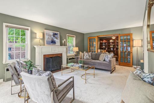 Adjacent to the living room is a den with operable french doors.