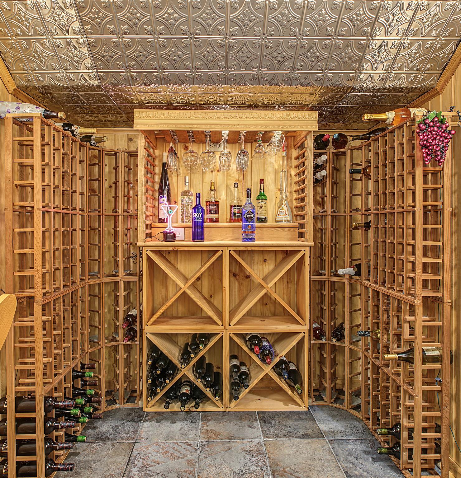 The wine storage stays with the home. There is enough storage for the most voracious collector!