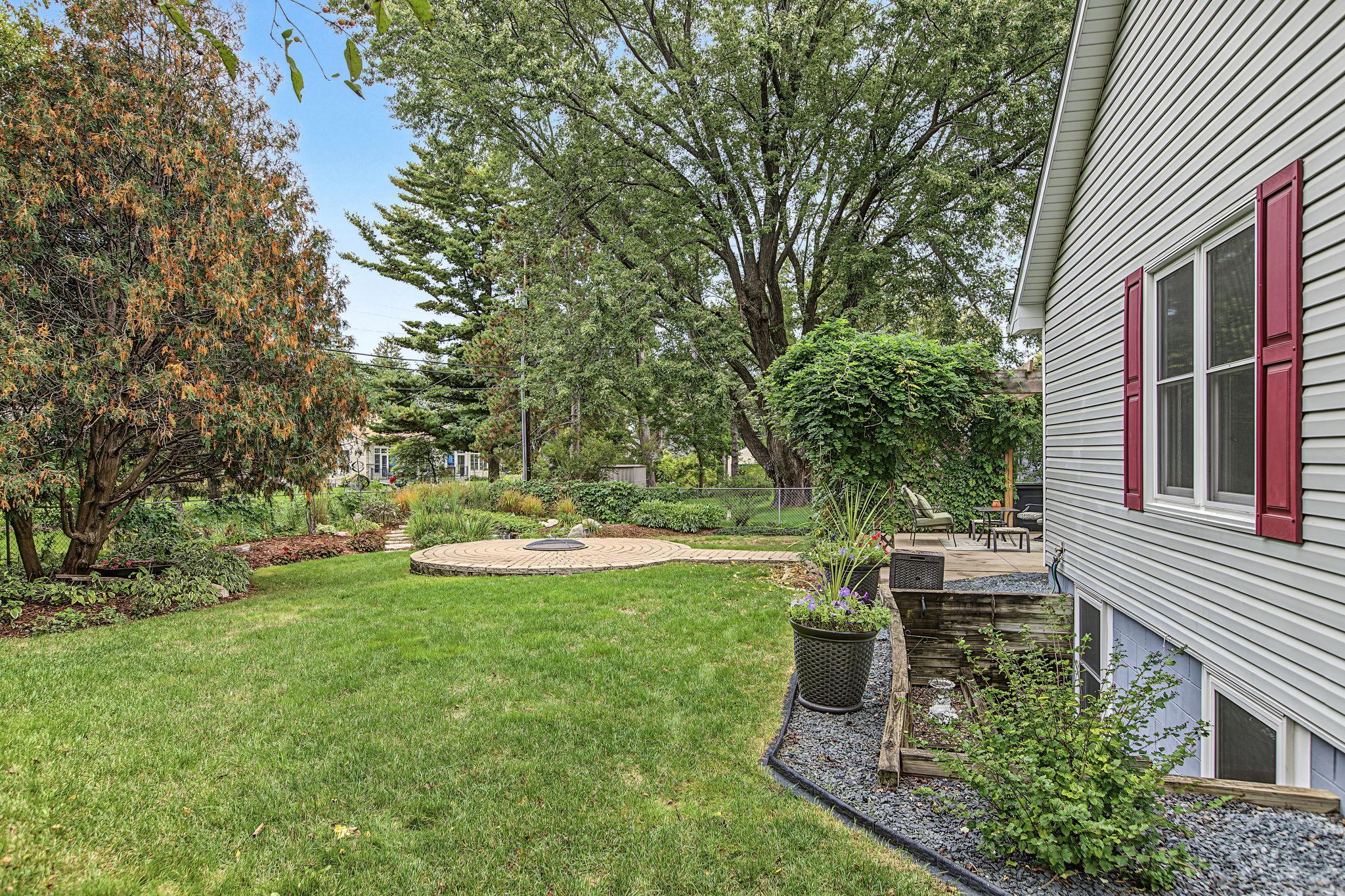 The fully fenced yard also features ample flat grassy areas for backyard recreation for humans and four legged pals alike.