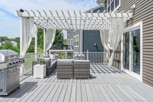 Stylish pergola with privacy curtains and ambient lighting—ideal for entertaining and outdoor relaxation.