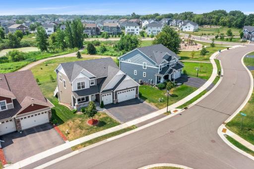 Angle capturing the home's position along the curved street and easy access to neighborhood amenities.