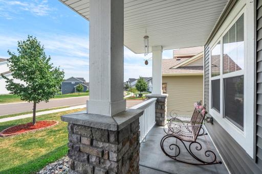 View looking out from the covered porch toward the peaceful neighborhood street.