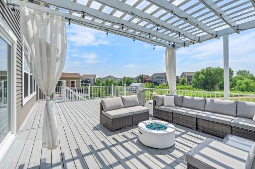 Wide shot emphasizing the full scope of the composite deck, seamlessly connecting indoor and outdoor living areas.