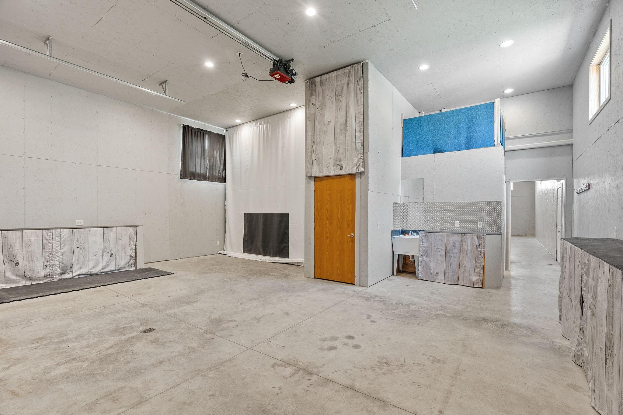 Incredible 35x70 finished Recreation Building featuring INDOOR basketball/sport court, golf zone, gaming & entertainment areas, Kitchenette, Baths, storage/hobby space & room for vehicles, toys or collections