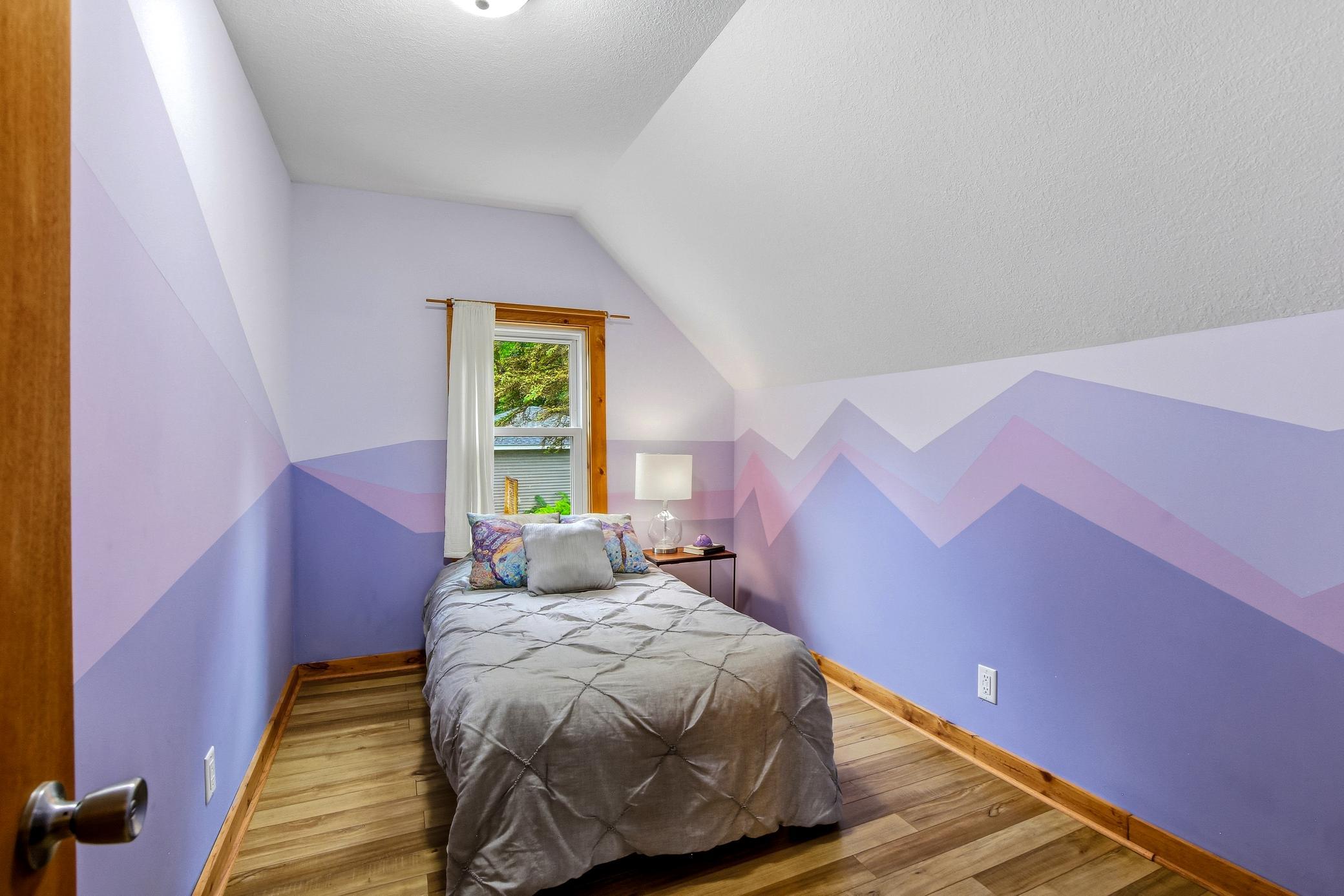 Bedroom 2 off primary. Perfect for nursery, yoga or craft room