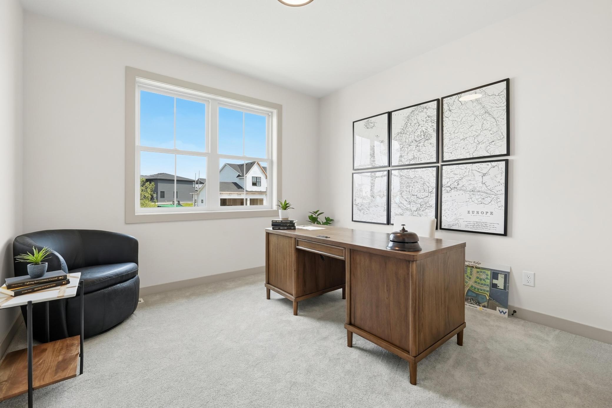 Dedicated main-floor office featuring plush carpeting, generous wall space, and a large double-hung window that floods the room with soft natural light—ideal for remote work or a private study. Or can be transformed into a cosy guest bedroom.