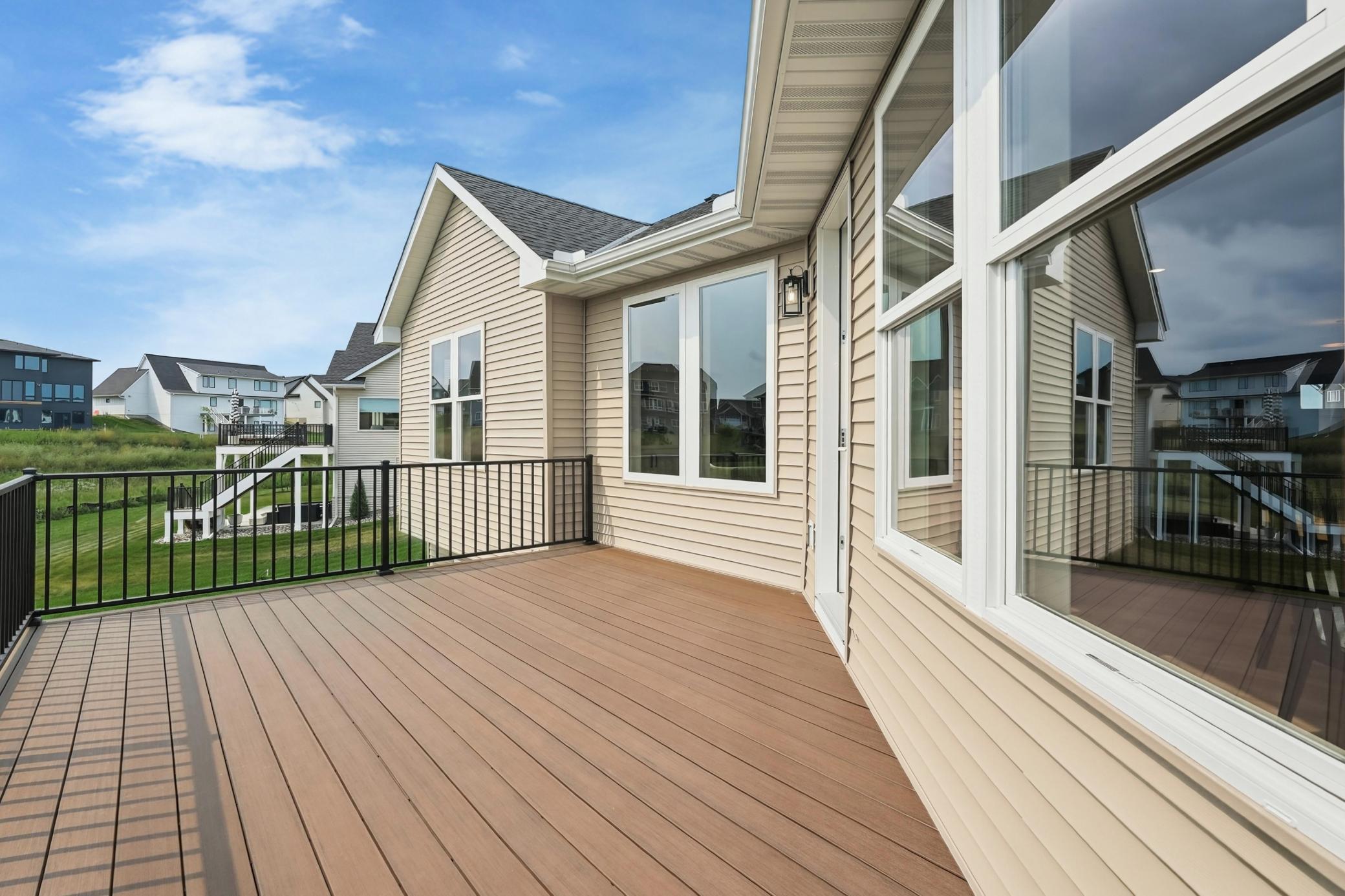 Elevated Outdoor Deck
Spacious composite deck with durable black metal railings, perfect for outdoor entertaining and enjoying sprawling views of the surrounding neighborhood.